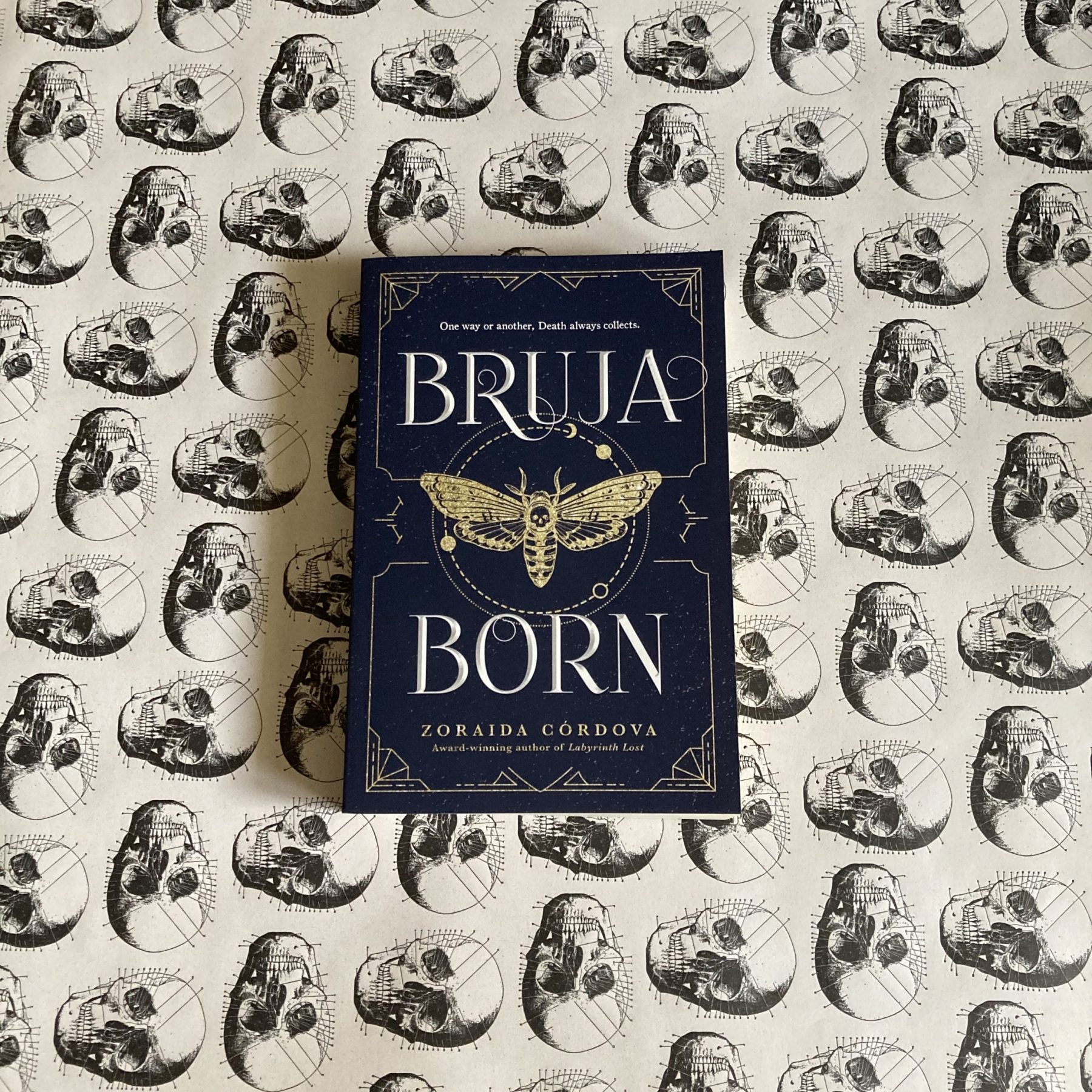 book Bruja Born on a white background with skulls