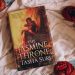 Hardcover of The Jasmine Throne on top of a light cloth and surrounded by 4 bright orange skeins of yarn