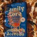 Hardcover copy of Family Lore by Elizabeth Acevedo in a pile of golden leaves